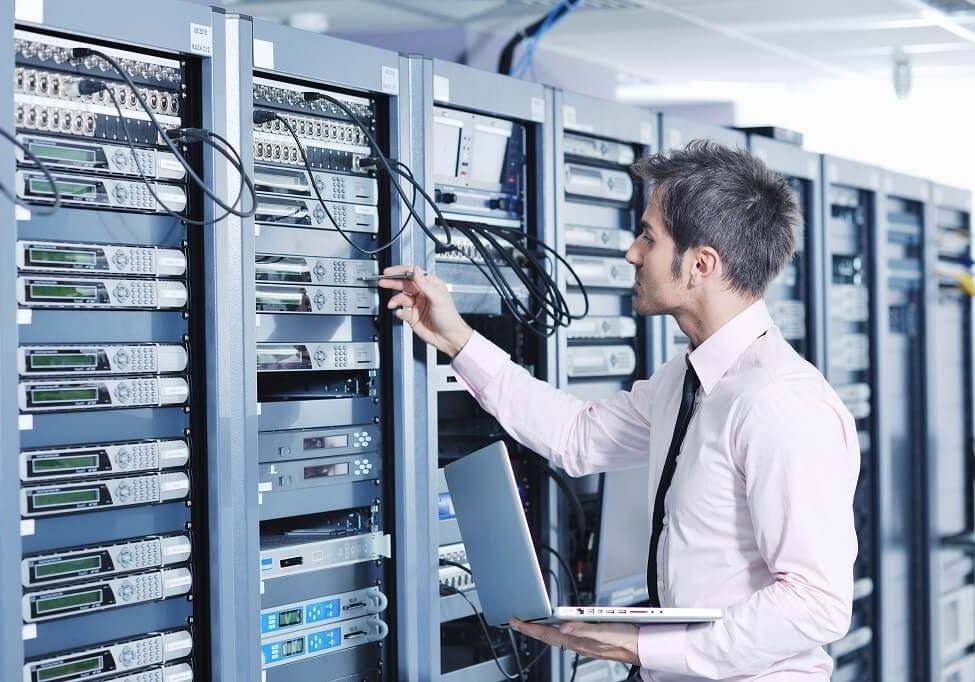 male working on servers
